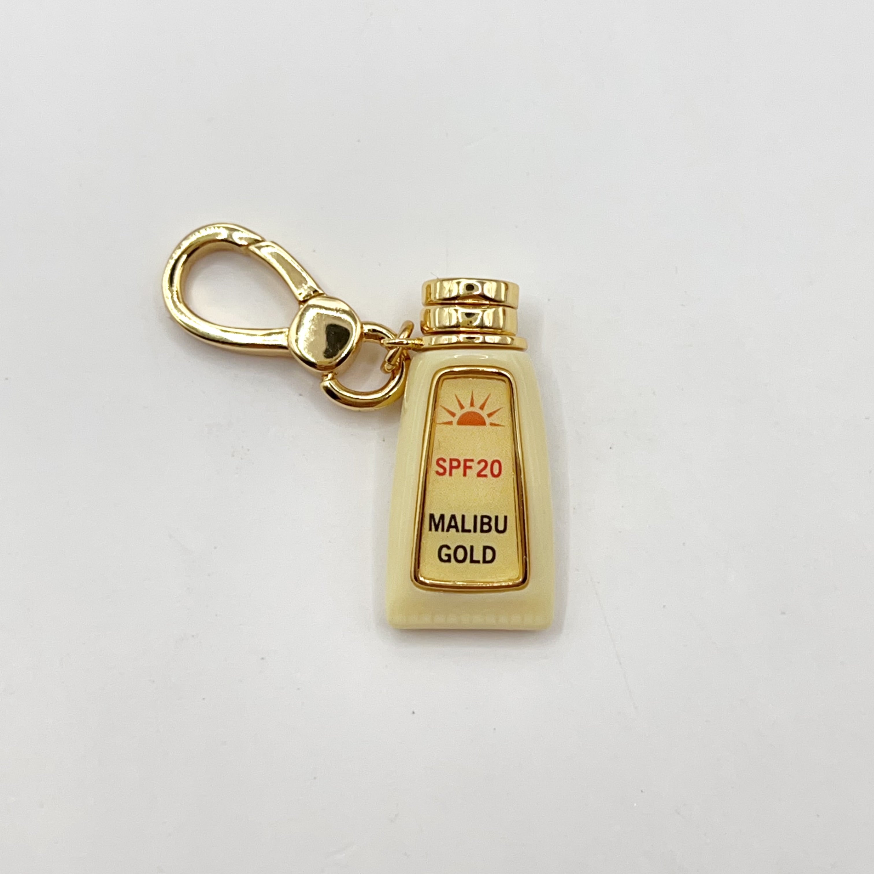 JC011-Juicy Couture tan oil charm