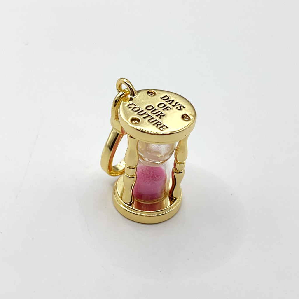 E04-Juicy Couture glass hour charm