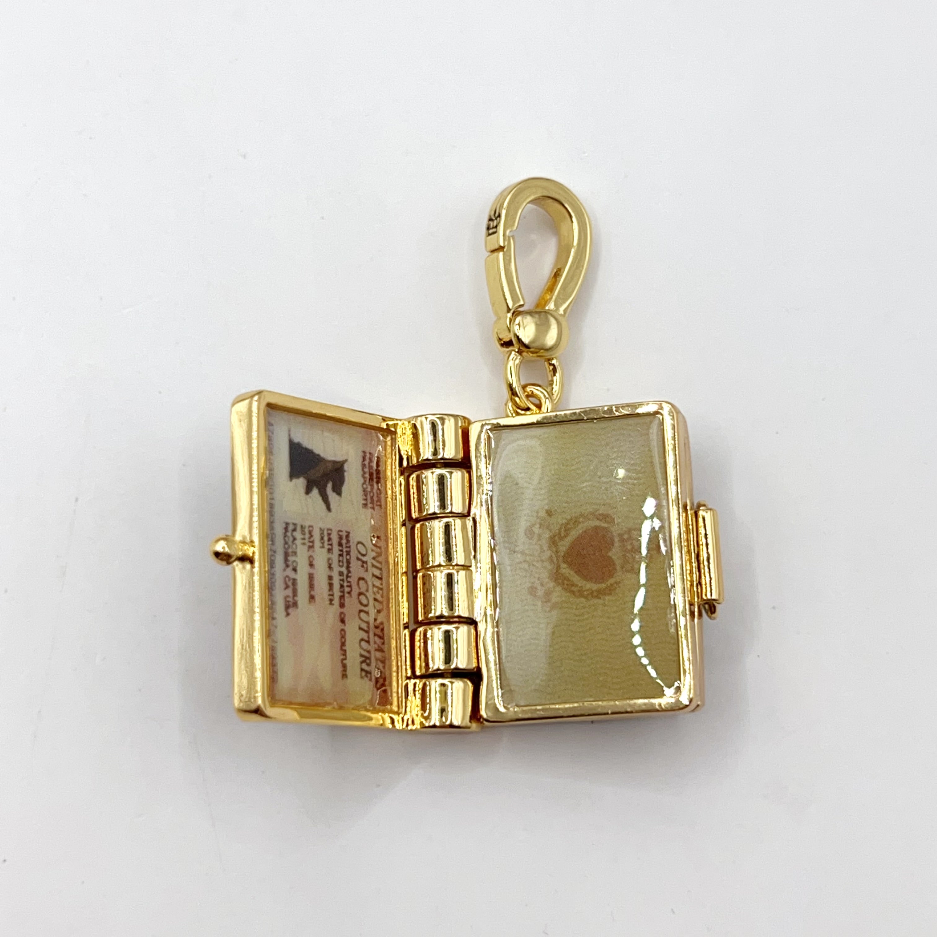 C03-Juicy Couture passport charm
