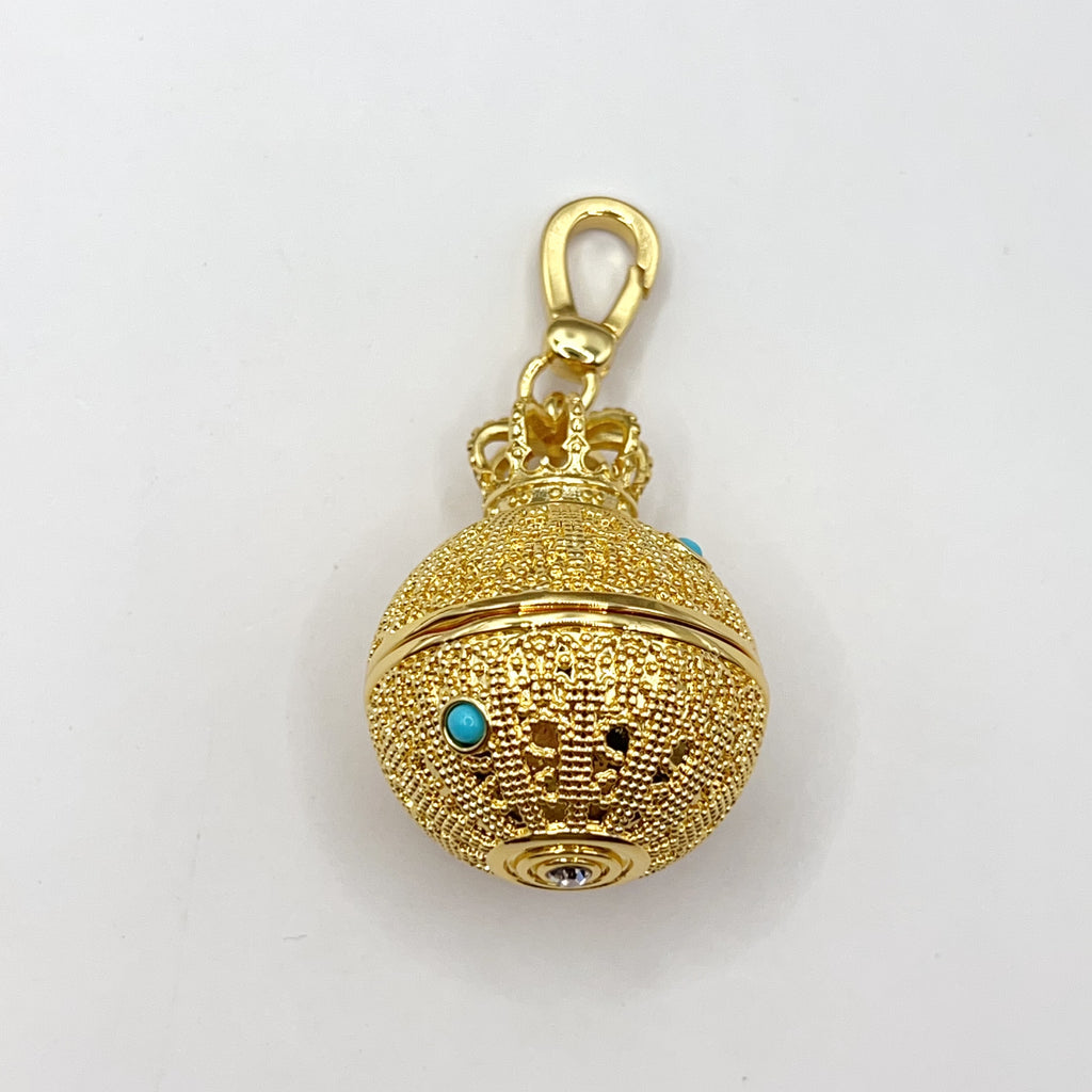 Juicy Couture gold ball with crown charm