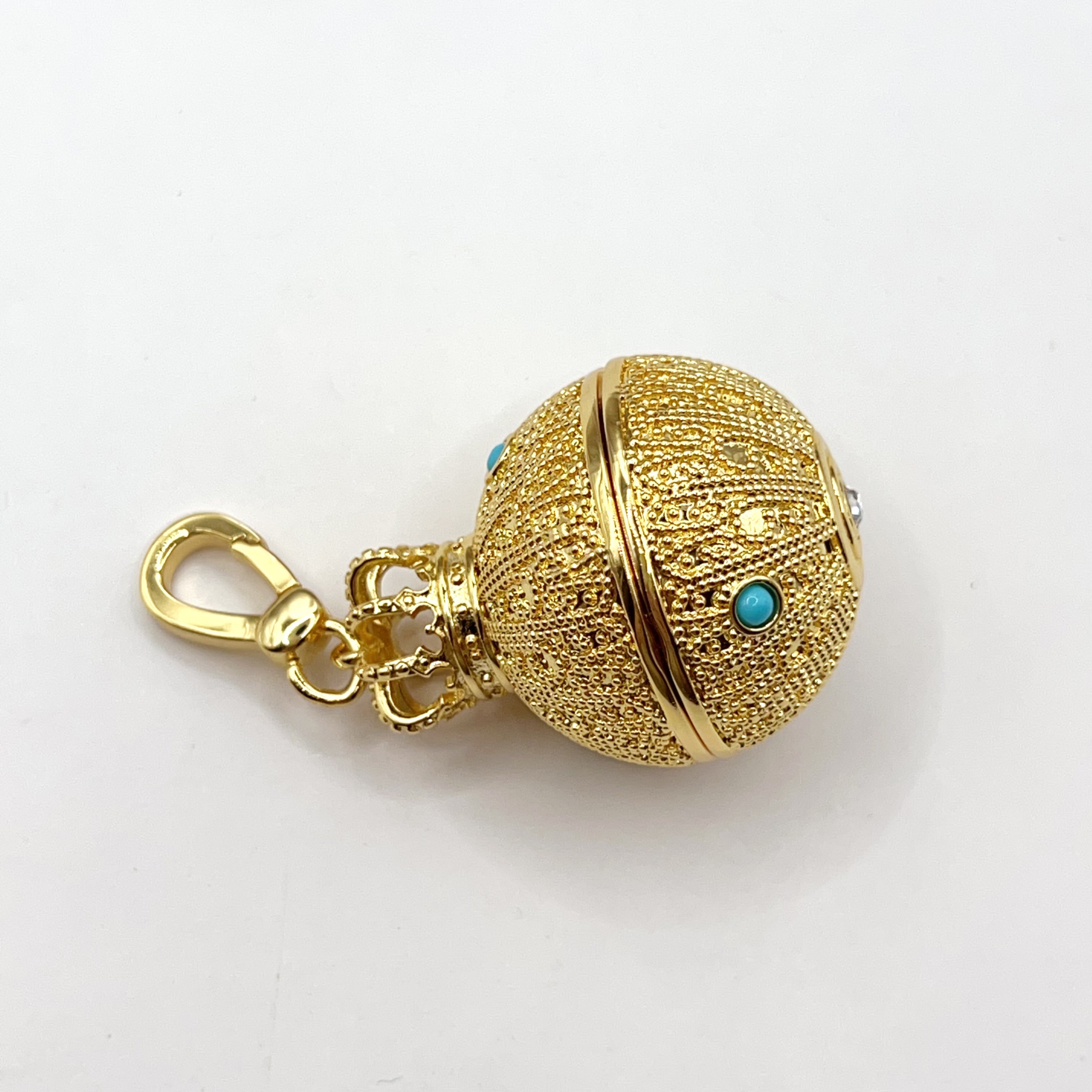 Juicy Couture gold ball with crown charm