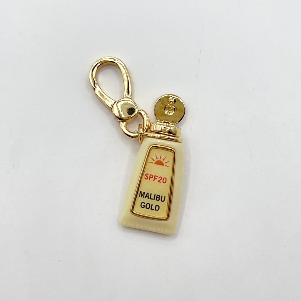 JC011-Juicy Couture tan oil charm