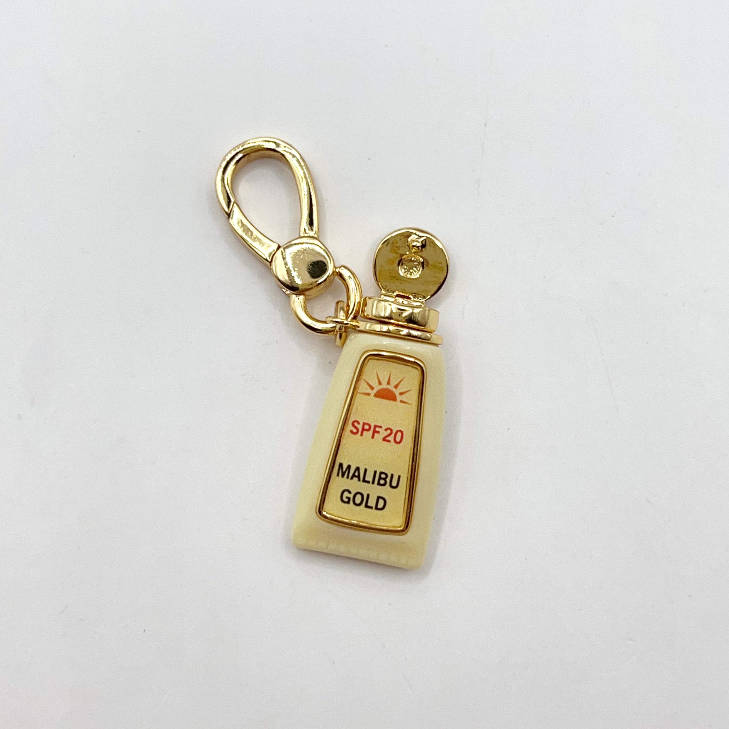 JC011-Juicy Couture tan oil charm